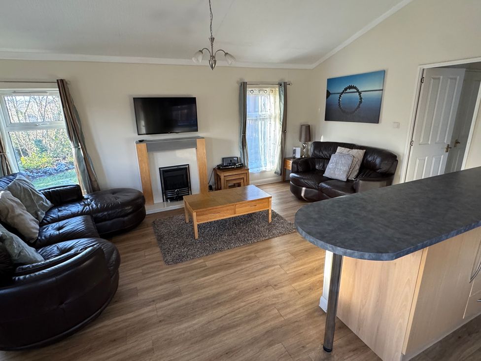 A living room with a sofa and coffee table at Woodland View 31 - The Hawthorns Finlakes Holiday Park near Chudleigh