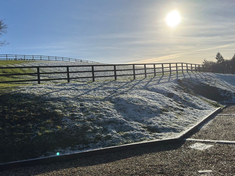 A hill with a fence and snow at Woodland View 31 - The Hawthorns Finlakes Holiday Park near Chudleigh