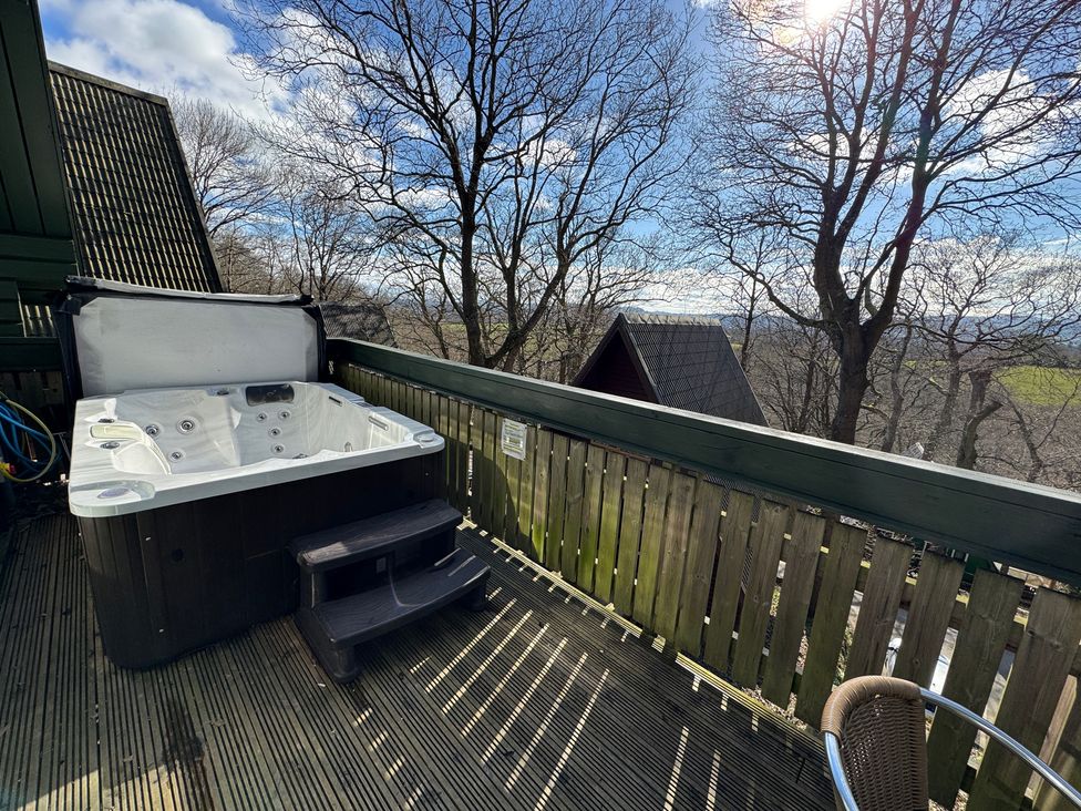 A hot tub on a deck at Tor View Finlakes Holiday Park near Chudleigh