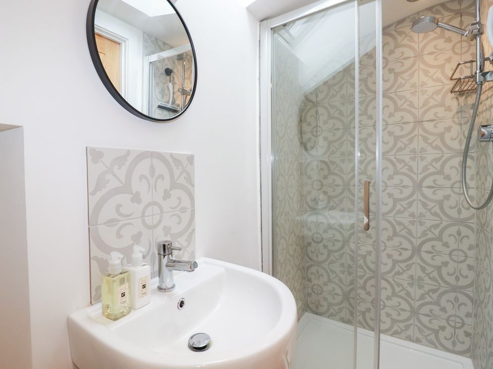 A bathroom with a sink and shower at Glendale in Port Isaac