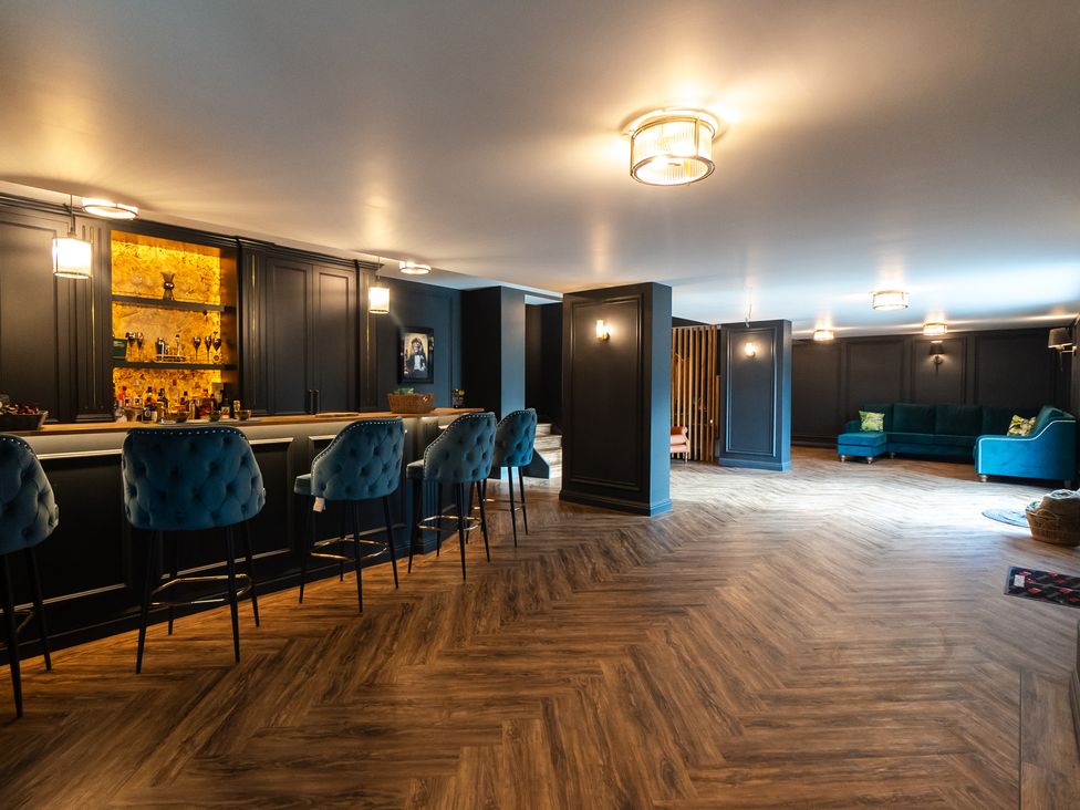 A basement with a bar and seating area at 30 High Lane East Ilkeston