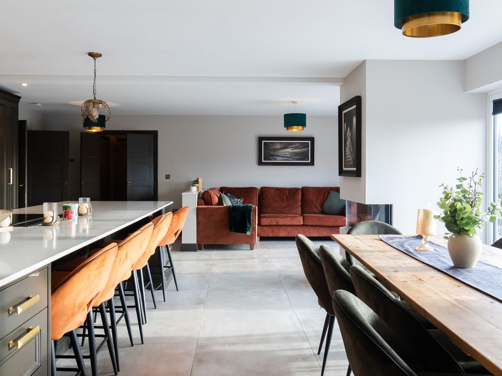 A kitchen with a dining area and living space at 30 High Lane East Ilkeston