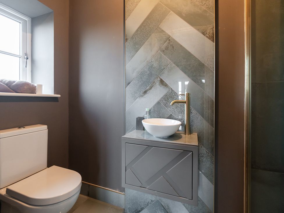 A bathroom with a sink and toilet at 30 High Lane East Ilkeston