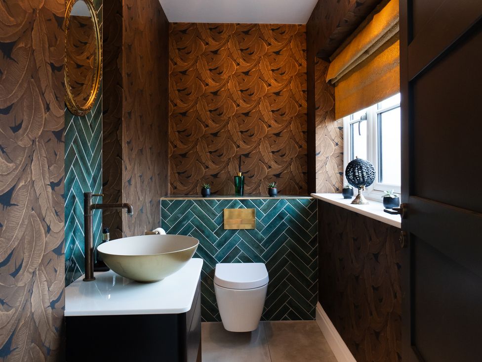 A bathroom with a sink and toilet at 30 High Lane East Ilkeston