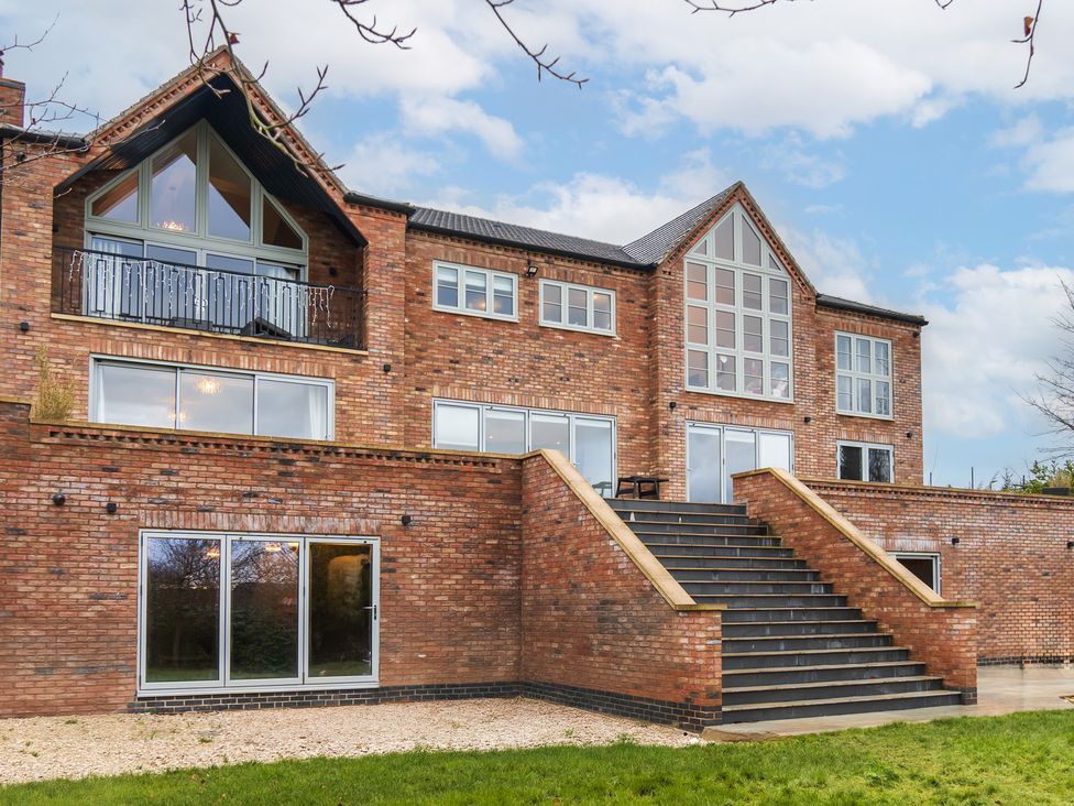 A brick building with stairs and windows at 30 High Lane East Ilkeston