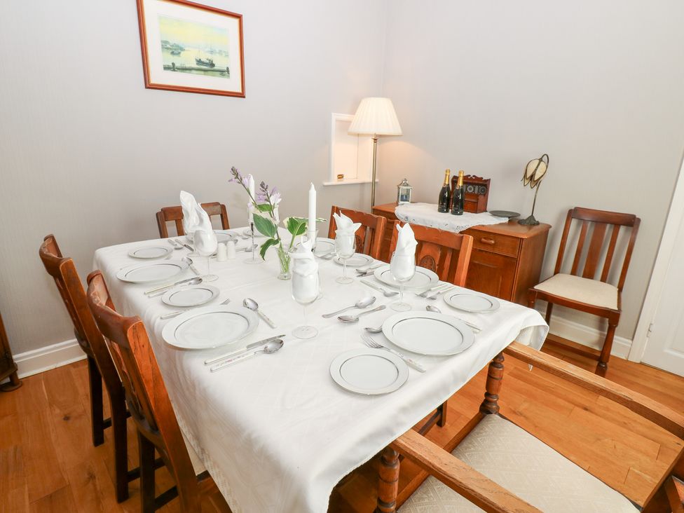 A dining room with a set table at South View, Gunnerside