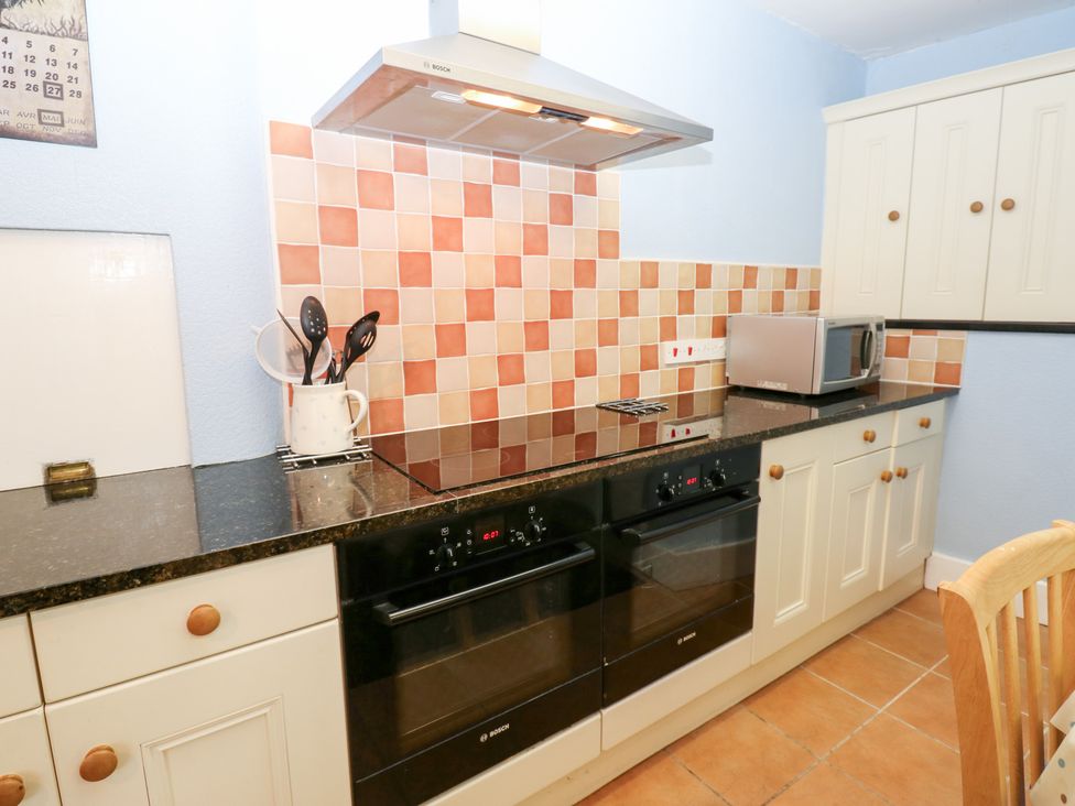 A kitchen with countertops and appliances at South View, Gunnerside