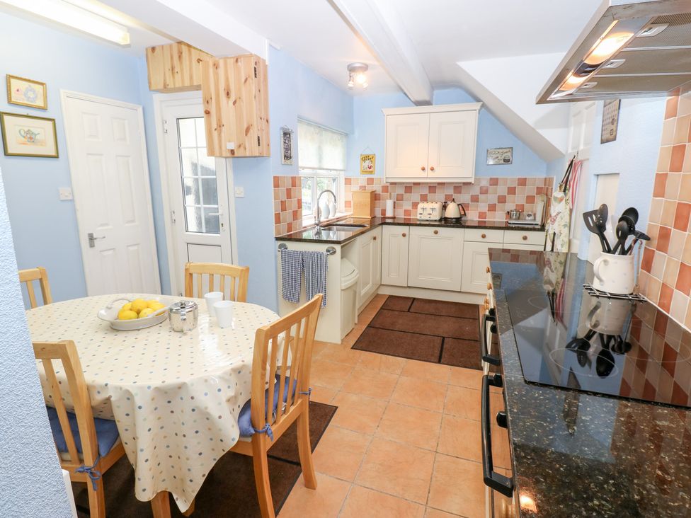 A kitchen with a table and chairs at South View, Gunnerside near Reeth