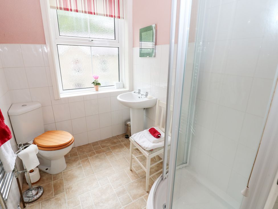 A bathroom with a shower and sink at South View, Gunnerside