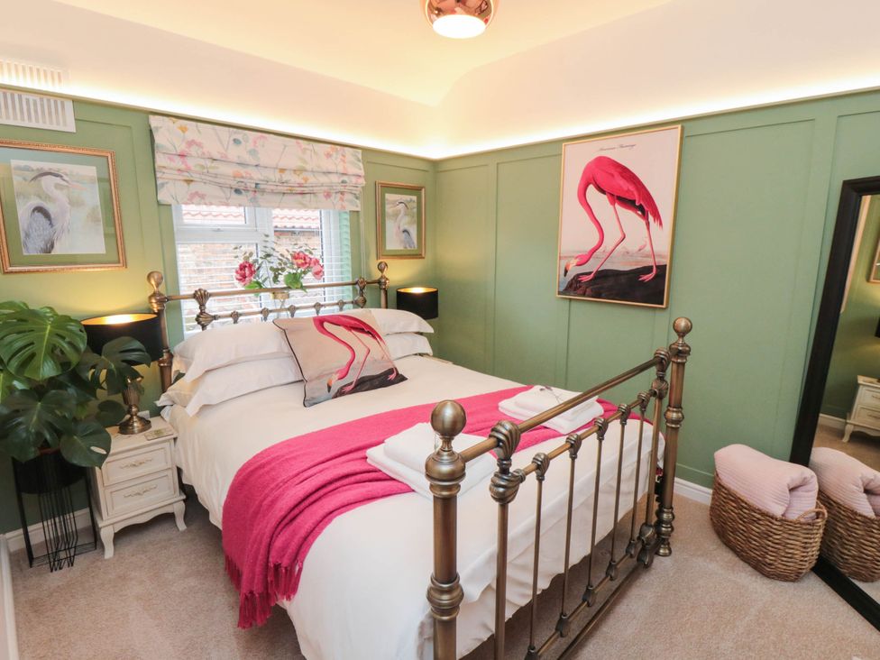 A bedroom with a bed and artwork at 5 South Side