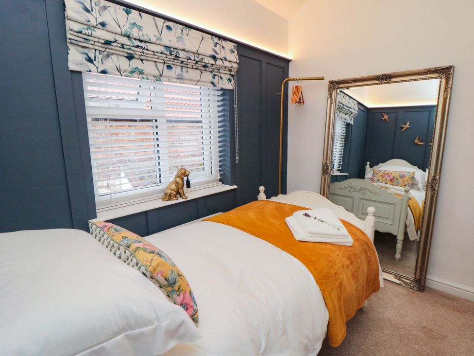 A bedroom with a bed and window at 5 South Side