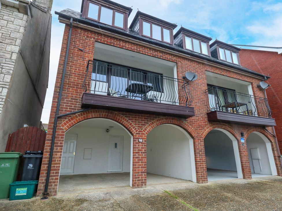 A building with balconies and parking space at The View in Weymouth