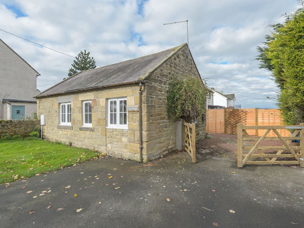 A house with a gate and garden area at The Forge in Morpeth