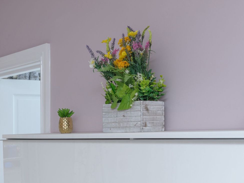 A flower arrangement and a succulent on a shelf at The Forge in Morpeth