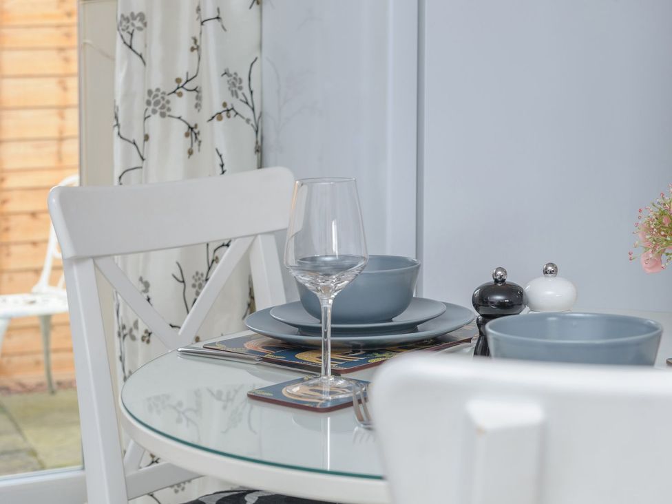 A dining table set with glass, bowls, and shakers at The Forge in Morpeth