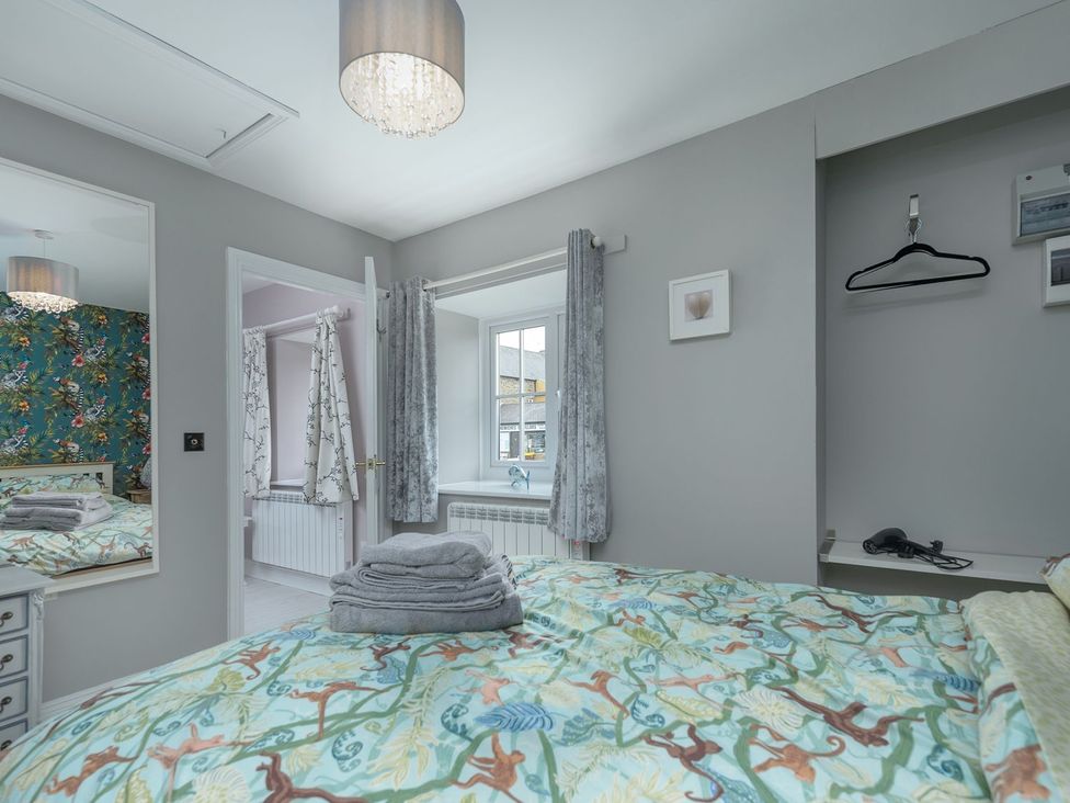 A bedroom with a bed and window at The Forge in Morpeth