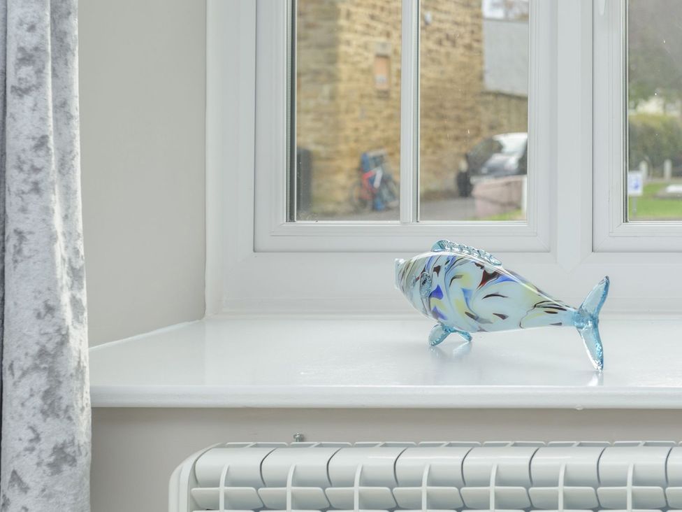 A decorative glass fish on a window sill at The Forge in Morpeth