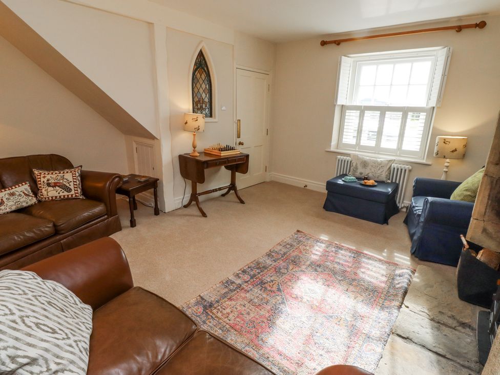 A living room with a sofa and a table at Peary House in Alnwick