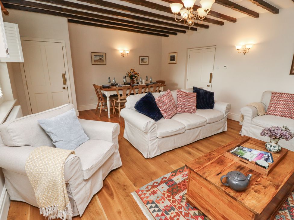A living room with sofas and a coffee table at Peary House in Alnwick