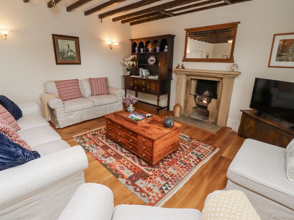 A living room with a coffee table and sofa at Peary House in Alnwick