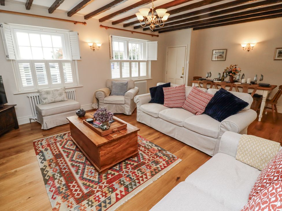 A living room with a coffee table and sofas at Peary House in Alnwick