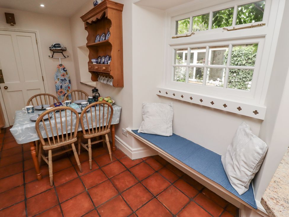 A kitchen with a dining table and chairs at Peary House in Alnwick