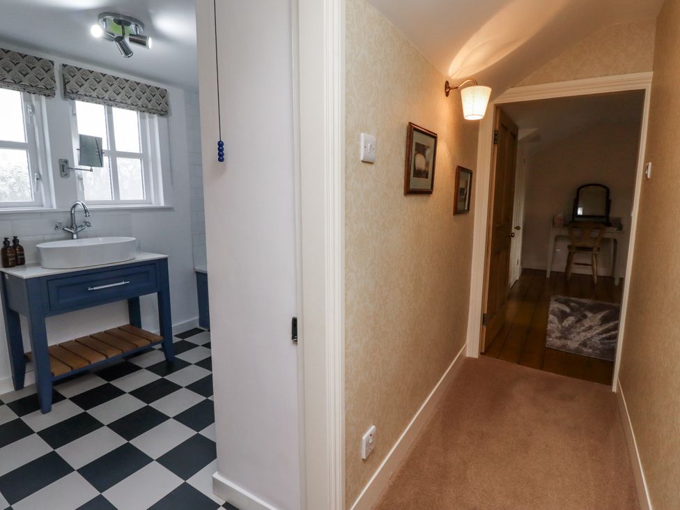 A hallway leading to a bathroom at Peary House in Alnwick