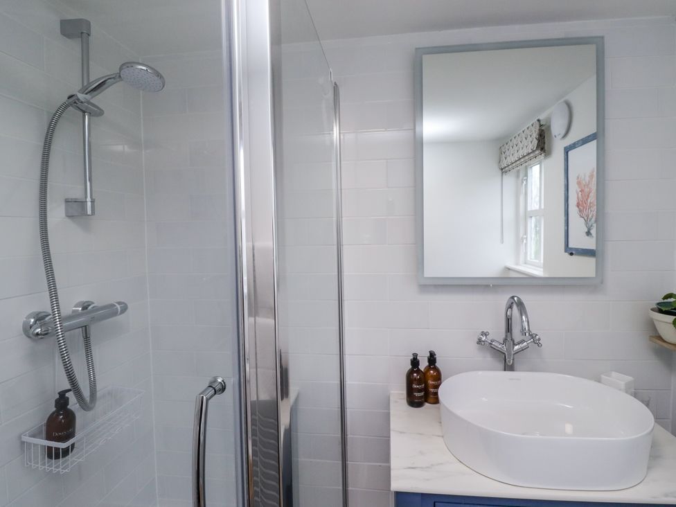A bathroom with shower and washbasin at Peary House in Alnwick