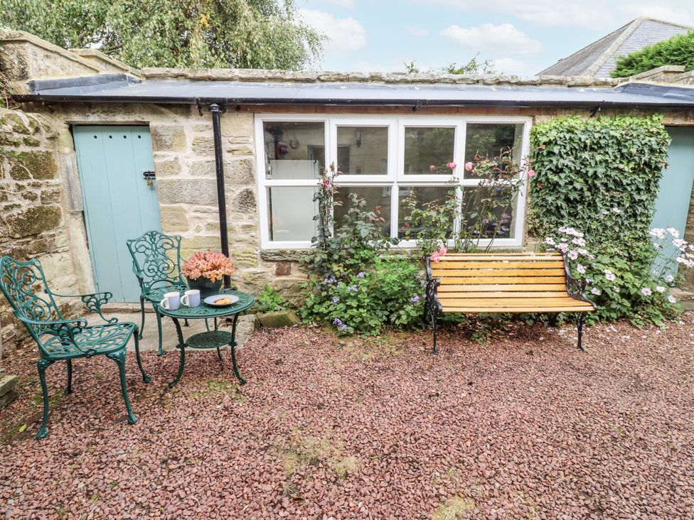 A patio area with a table and chairs at Peary House Alnwick