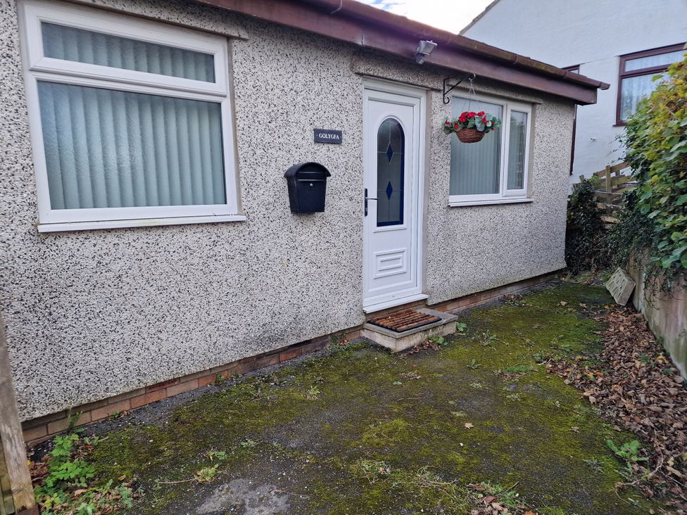 An entrance with a door and window at Golygfa in Abergele
