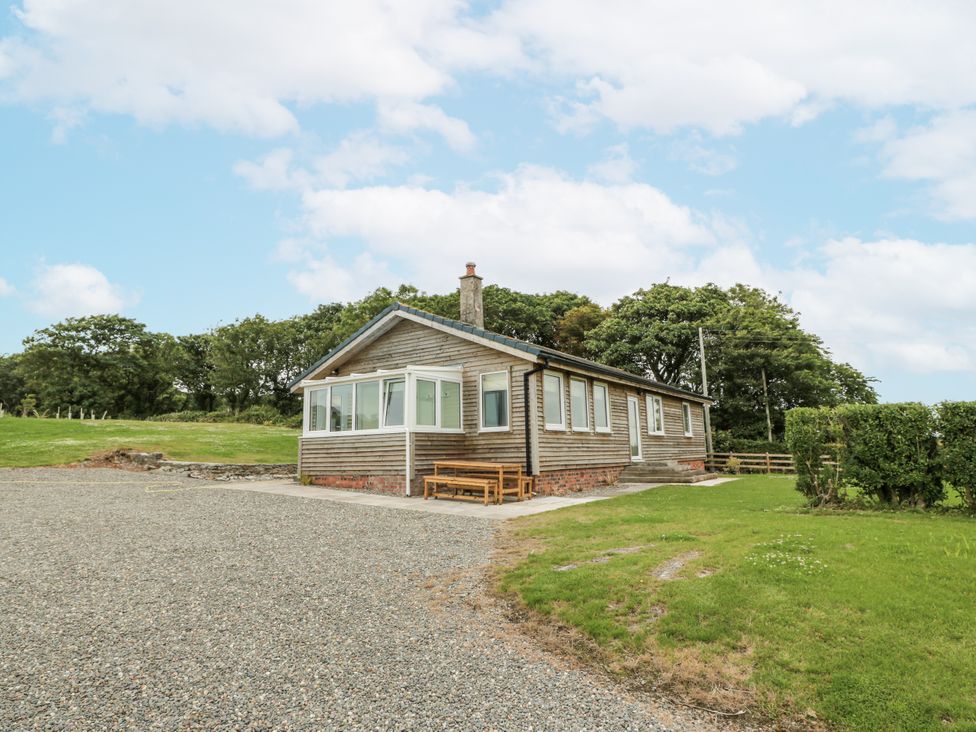 A house with windows and a gravel drive at The Dairy in Newton Stewart