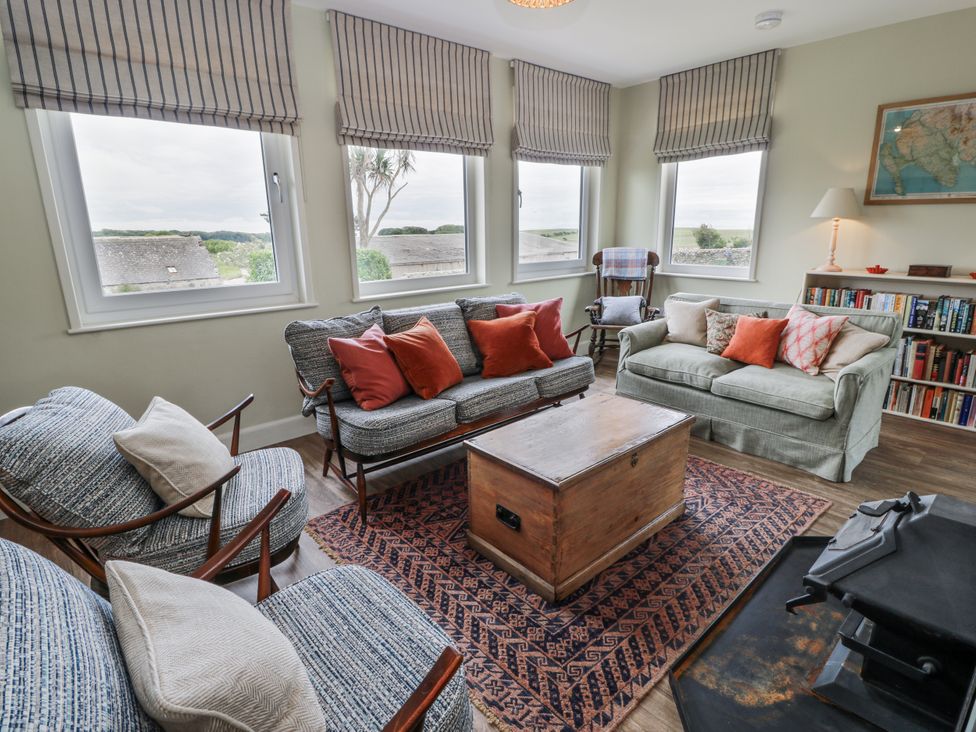 A living room with a coffee table and seating arrangements at The Dairy in Newton Stewart
