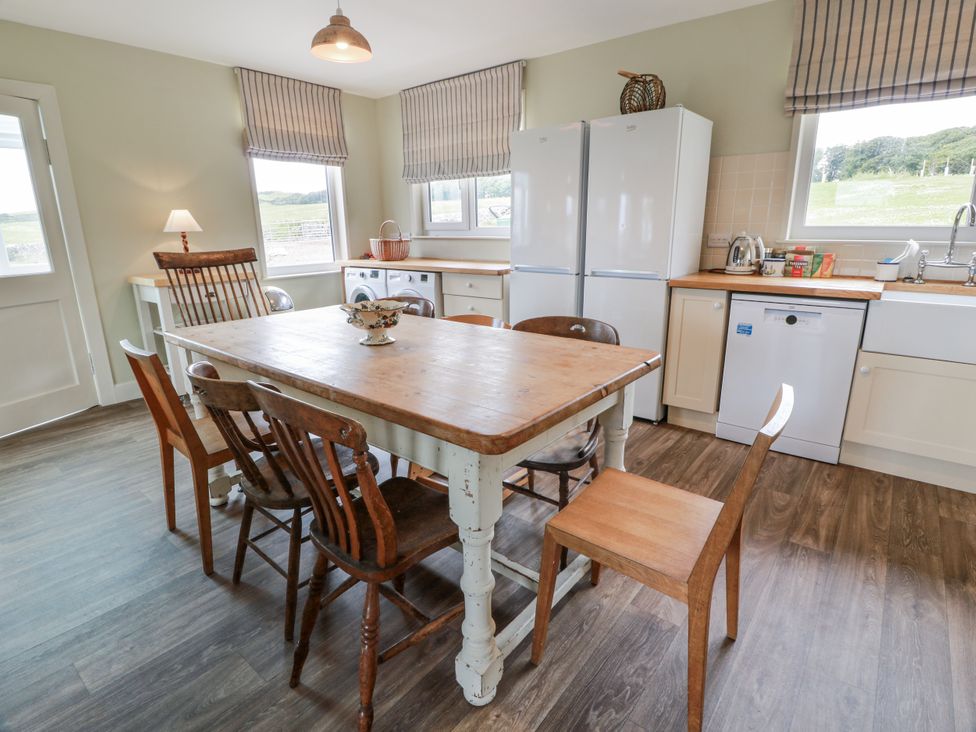 A kitchen with a table and chairs at The Dairy in Newton Stewart