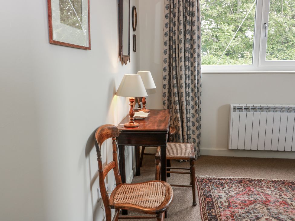 A study with a table and two chairs at The Dairy in Newton Stewart