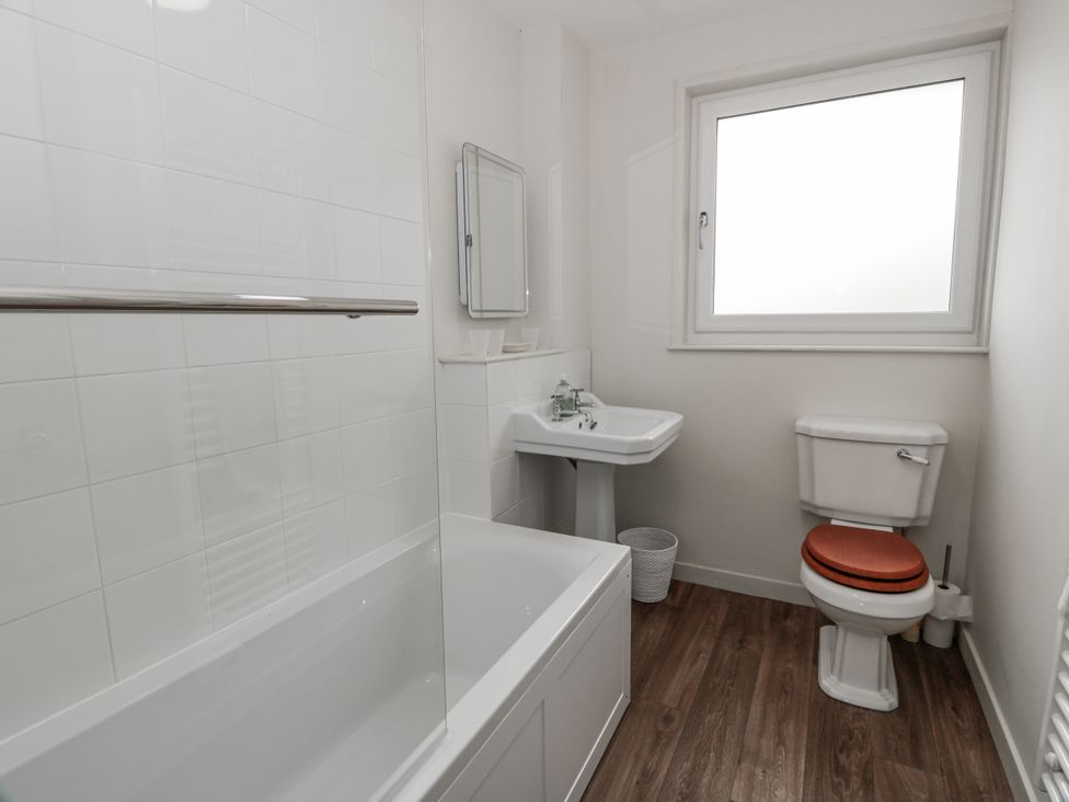 A bathroom with a bathtub and toilet at The Dairy in Newton Stewart
