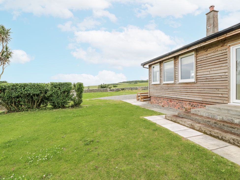 A house with a pathway and grass area at The Dairy in Newton Stewart