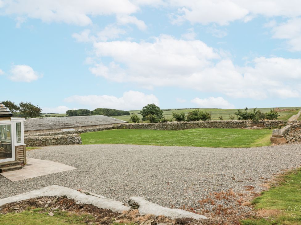 An outdoor area with gravel and grass at The Dairy in Newton Stewart