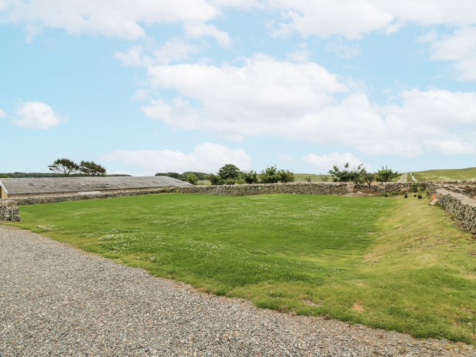 An outdoor area with grass and gravel at The Dairy in Newton Stewart