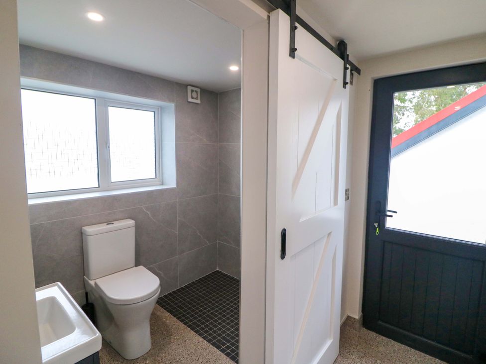 A bathroom with a toilet and shower at Valley View House in Kealkill, County Cork