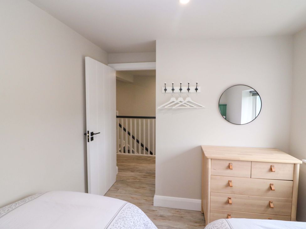 A bedroom with a dresser and mirror at Valley View House, Kealkill, County Cork