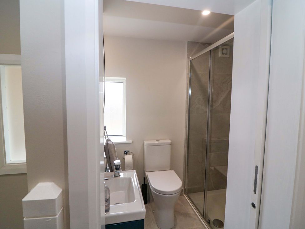 A bathroom with a toilet, sink, and shower at Valley View House, Kealkill, County Cork