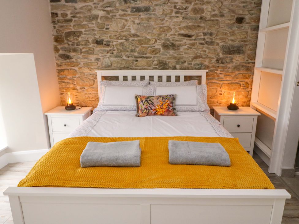 A bedroom with a bed and nightstand at Valley View House in Kealkill, County Cork