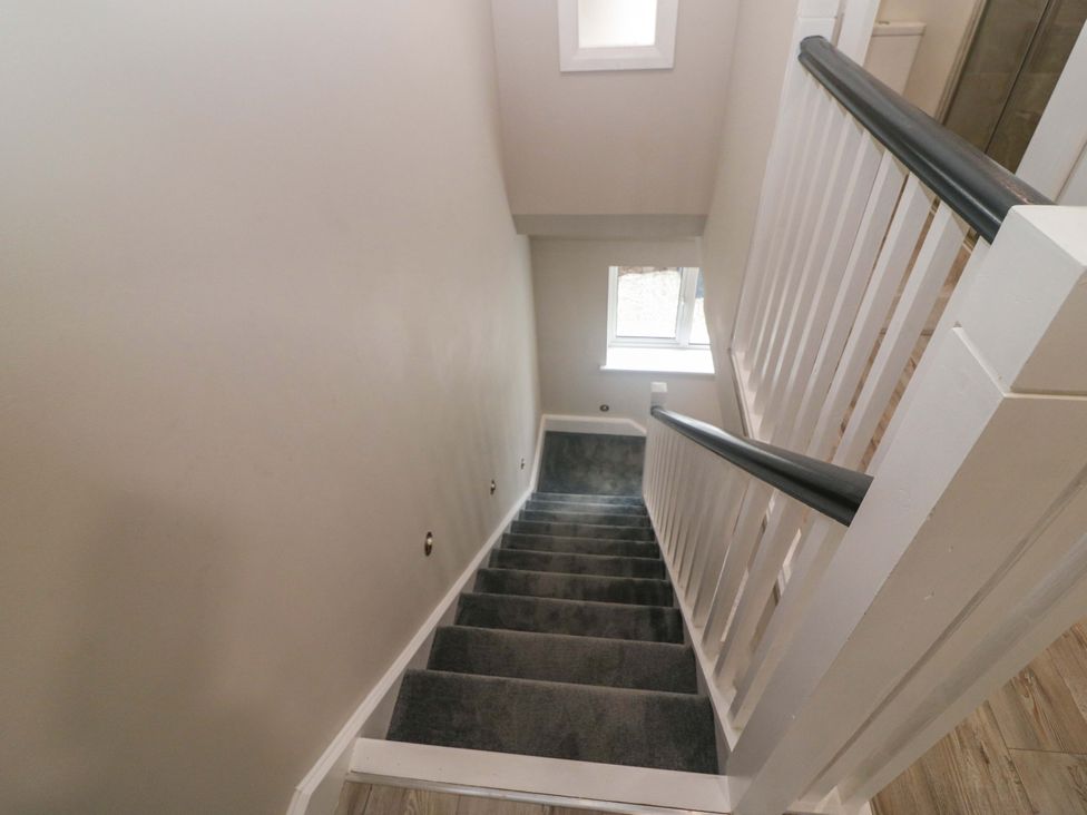 A staircase with stairs and a window at Valley View House Kealkill, County Cork