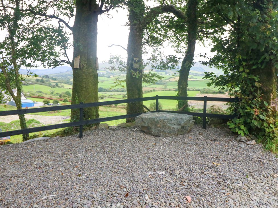 A viewpoint with trees and a rock at Valley View House in Kealkill, County Cork