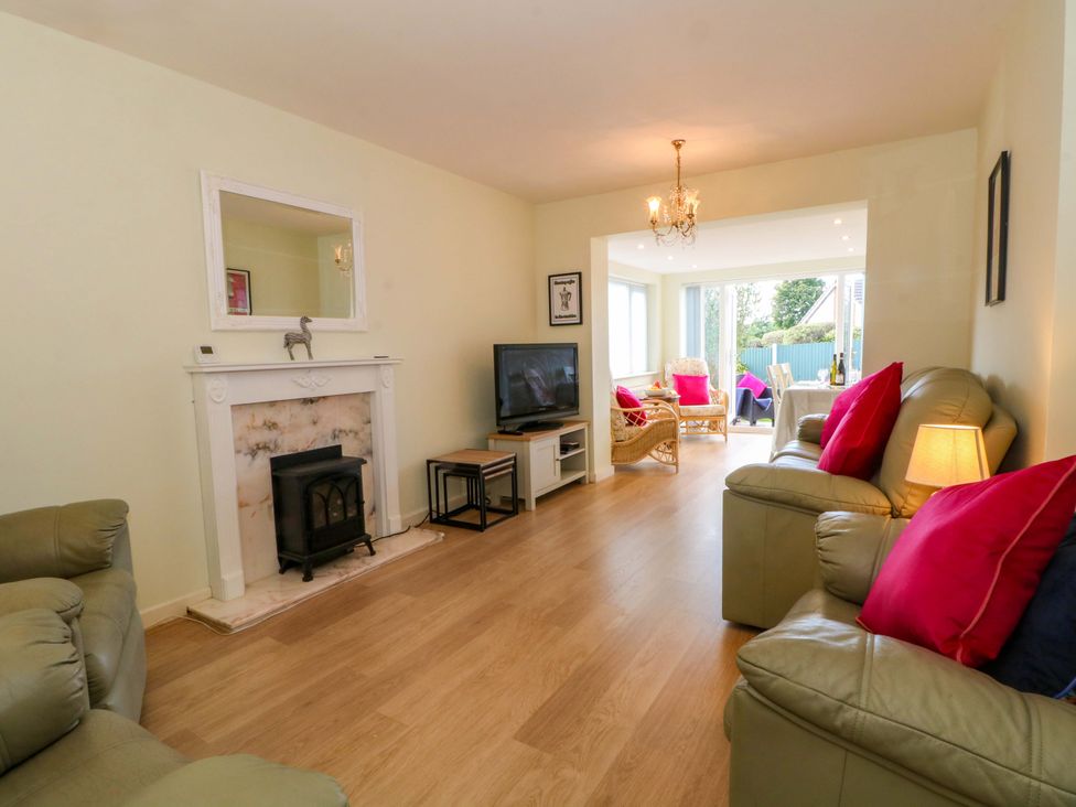 A living room with a fireplace and television at The Warren in Chester