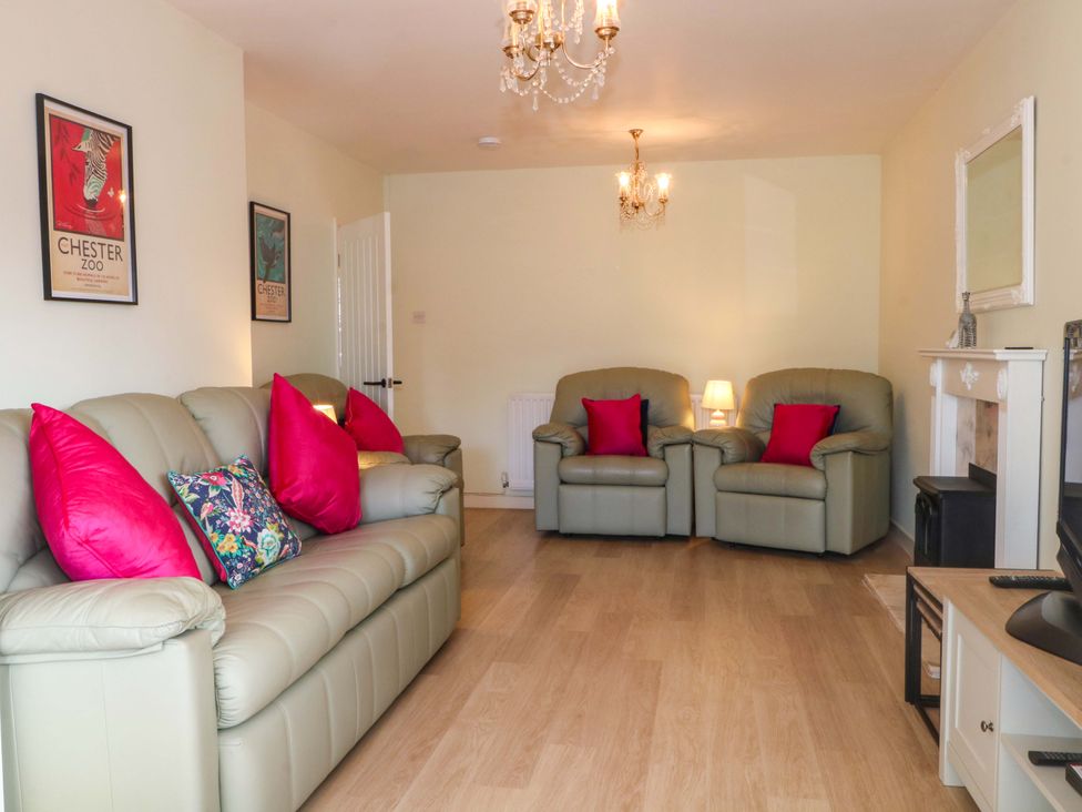 A living room with seating and wall art at The Warren in Chester