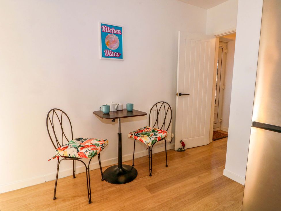 A kitchen with a table and two chairs at The Warren in Chester