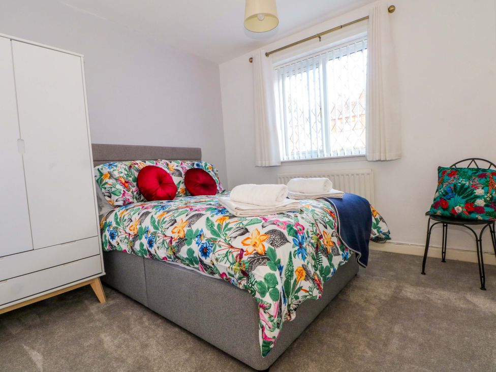 A bedroom with a bed and wardrobe at The Warren in Chester