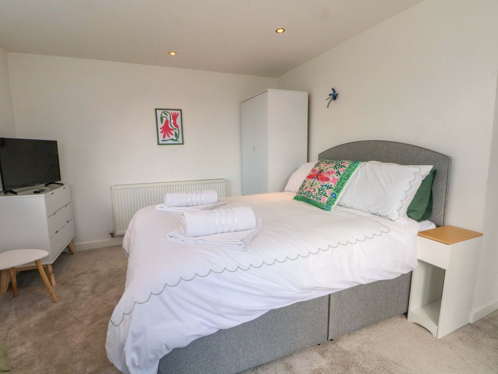 A bedroom with a bed and television at The Warren in Chester