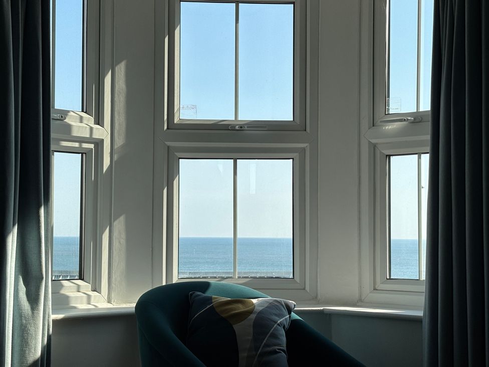 A living room with a view of the sea at Belle's View in Scarborough
